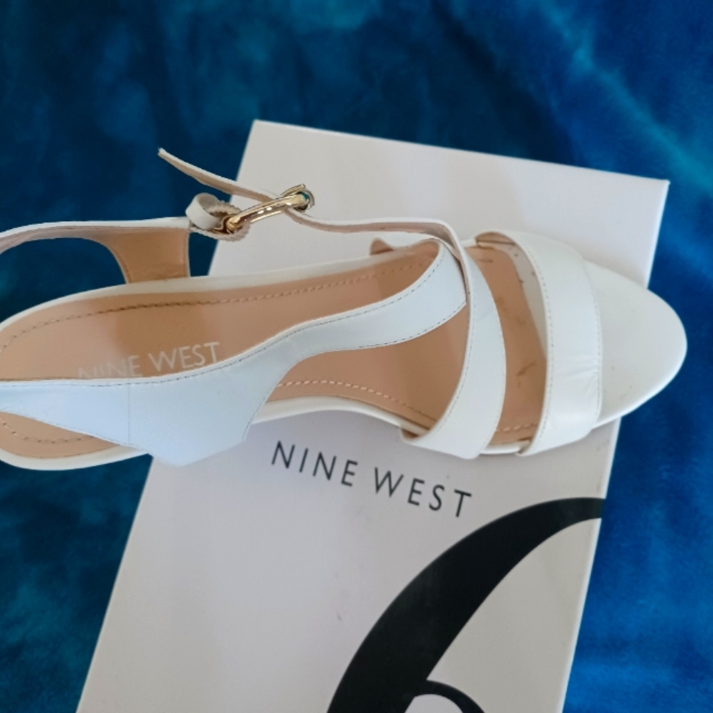 White sandals by Nine West 2.5 inch heels. Size 6. Clean as new.